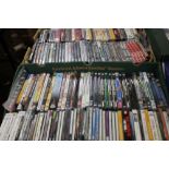 TWO TRAYS OF DVDS AND CDS