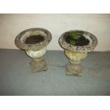 TWO CONCRETE PLANTERS WITH BASES