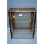 A VINTAGE UPRIGHT SHOP COUNTER TOP DISPLAY CABINET, WOOD FRAME AND GLAZED, FITTED WITH THREE