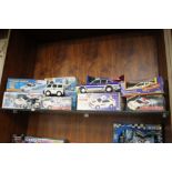 A COLLECTION OF BOXED MODEL POLICE EMEREGENCY VEHICLES ETC.