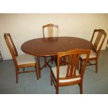 A TEAK DINING SET WITH FOUR NATHAN CHAIRS AND A DROP LEAF GATELEG TABLE