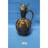 A ROYAL DOULTON LIDDED JUG