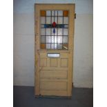 A VINTAGE HARDWOOD FRONT DOOR WITH LEADED GLASS