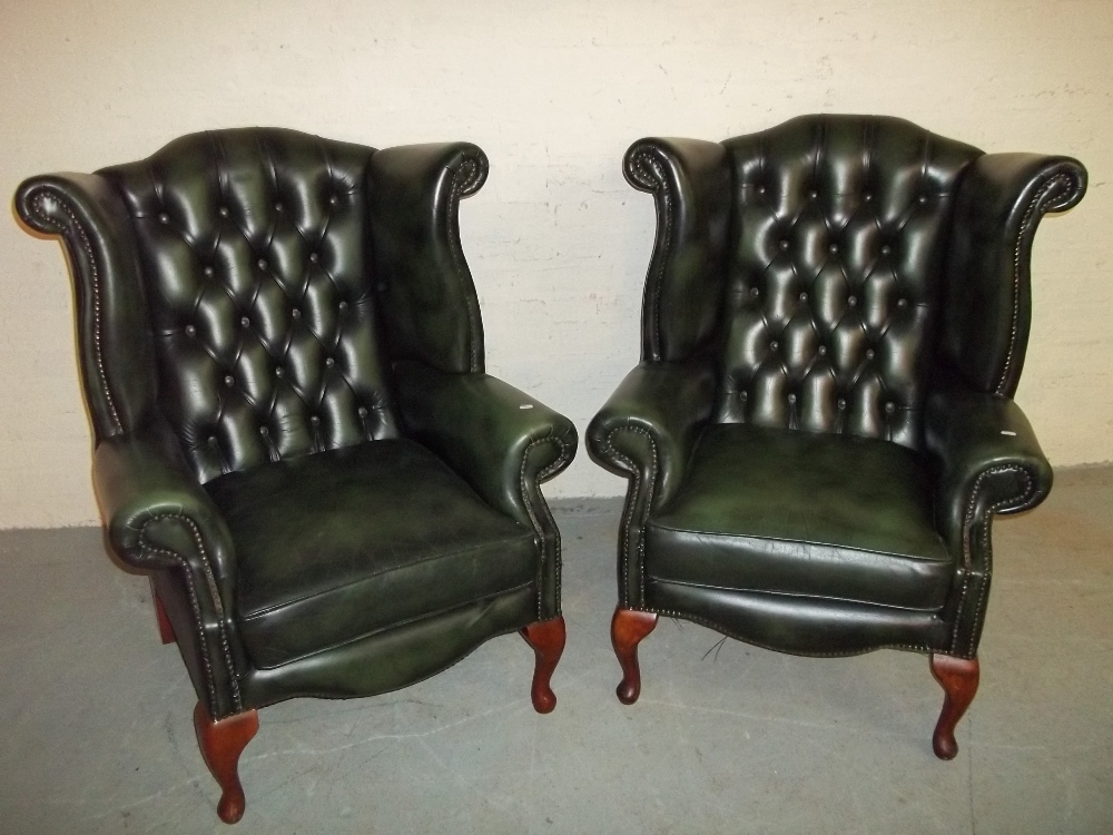 TWO LEATHER WING BACKED QUEEN ANN LEGGED CHESTERFIELD CHAIRS