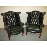TWO LEATHER WING BACKED QUEEN ANN LEGGED CHESTERFIELD CHAIRS