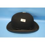 EQUESTRIAN BOWLER HAT BY G. A. DUNN & CO LTD., BLACK WITH SHAPED BRIM, RED SATIN LINING, SILK EDGING