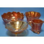 FOUR PIECES OF CARNIVAL GLASS TO INCLUDE TWO FOOTED BOWLS, A FOOTED JUG AND A FLAT BOTTOMED BOWL