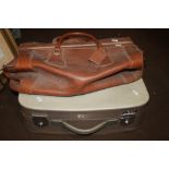 A VINTAGE LEATHER BAG AND A SUITCASE