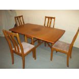 A MODERN TEAK DROP LEAF DINING TABLE AND FOUR CHAIRSCondition Report:SOME FADING AND LIGHT WEAR