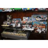 A COLLECTION OF BOXED AND UNBOXED EMERGENCY VEHICLES INCLUDING POLICE