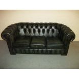 A LEATHER CHESTERFIELD THREE SEATER SOFA