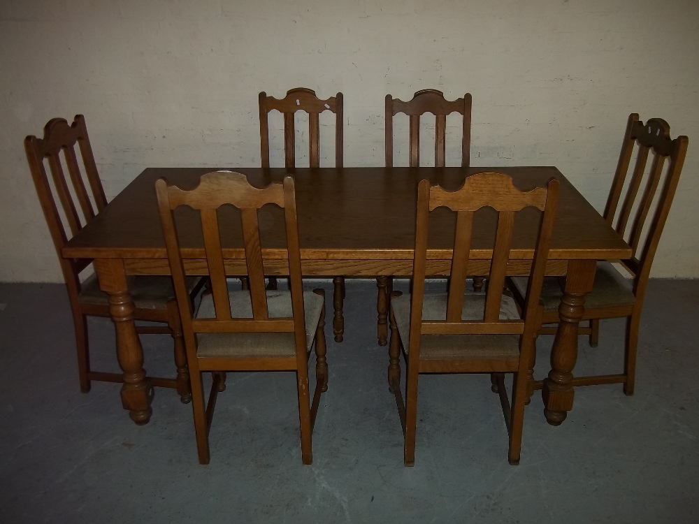 AN OAK DINING SET WITH SIX CHAIRS