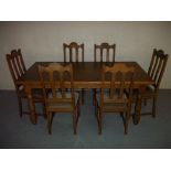 AN OAK DINING SET WITH SIX CHAIRS