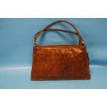 A VINTAGE CROCODILE SKIN HANDBAG