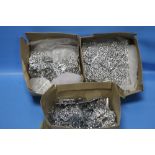 A QUANTITY OF WHITE METAL BELT BUCKLES