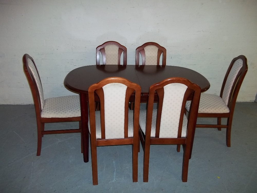 A MODERN EXTENDING DINING SET WITH SIX CHAIRS