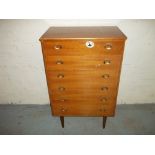 A VINTAGE CHEST OF DRAWERS