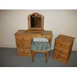 A PINE DRESSING TABLE WITH MIRROR AND A THREE DRAWER CHEST