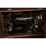 A CASED SINGER SEWING MACHINE