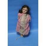 A 19TH CENTURY FRENCH BISQUE HEADED DOLL