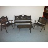 A CAST IRON FOUR PIECE GARDEN BENCH SET