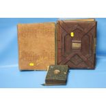 AN EDWARDIAN POSTCARD ALBUM AND CONTENTS TOGETHER WITH TWO VICTORIAN PHOTOGRAPH ALBUMS