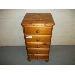 A PINE FIVE DRAWER CHEST WITH BUN FEET