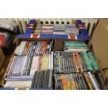 THREE TRAYS OF CDS AND DVDS, (TRAYS NOT INCLUDED)