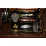 AN ANTIQUE SINGER SEWING MACHINE