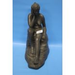 A CLAY FIGURE OF A SEATED LADY, H 31 CM