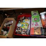 TWO TRAYS OF BOOKS DVDS ETC TO INCLUDE '"FAMILY GUY'", '"BOTTOM'" ETC. TOGETHER WITH A BOX OF