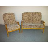 A TWO PIECE SUITE COMPRISING TWO SEATER SOFA AND A CHAIR