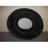 A ROLL OF 100MM DIAMETER LAND DRAINAGE PIPE