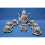 A CERAMIC COFFEE SET DECORATED WITH CONTINENTAL STYLE FIGURES