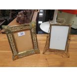 A VINTAGE EASEL BACKED PIERCED BRASS PICTURE FRAME' TOGETHER WITH ANOTHER (2)