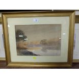 A GILT FRAMED AND GLAZED WATERCOLOUR DEPICTING A RIVER LANDSCAPE AT SUNSET SIGNED LOWER LEFT C.H