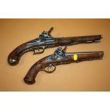 A REPRODUCTION DECORATIVE DOUBLE BARREL FLINTLOCK PISTOL TOGETHER WITH A SINGLE BARREL EXAMPLE (2)