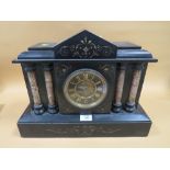 A VINTAGE SLATE MANTEL CLOCK WITH COLUMN DETAIL