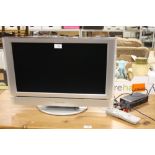 A PANASONIC 22" FLATSCREEN TV - REMOTE H/C