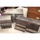 A VINTAGE TOOL CHEST TOGETHER WITH TWO MINIATURE SETS OF DRAWERS WITH CONTENTS