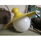 A RETRO STYLE YELLOW CEILING LIGHT