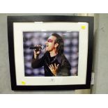 A FRAMED AND GLAZED U2 INTEREST SIGNED PHOTOGRAPH OF BONO