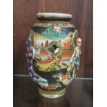 AN ORIENTAL JAPANESE FIGURATIVE VASE WITH MARKERS TO BASE