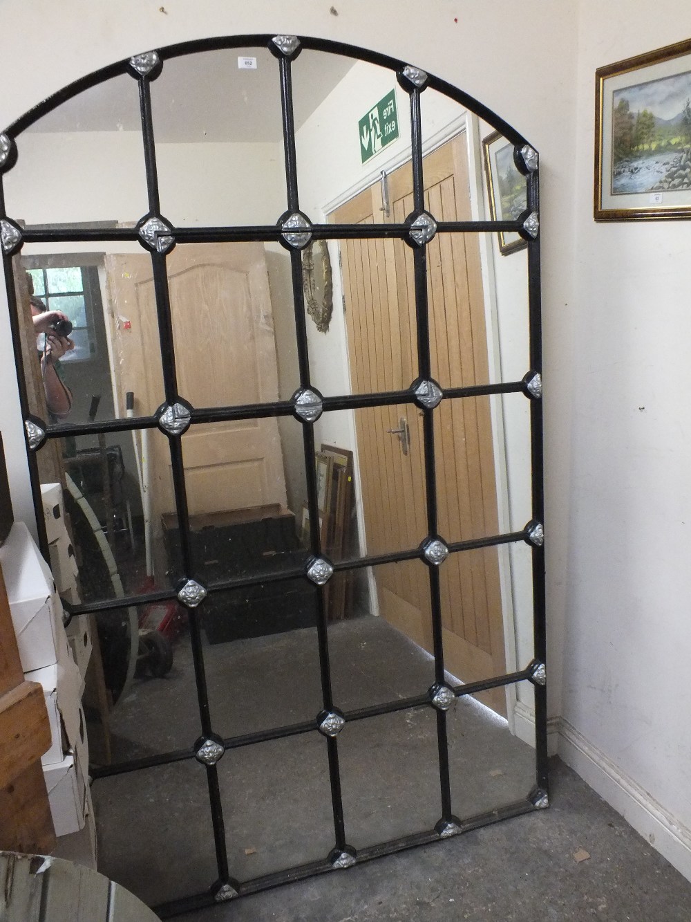 A LARGE ARCHED CAST IRON LATTICE STYLE MIRROR H- 198 CM W - 122 CM