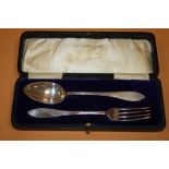 A BOXED HALLMARKED SILVER SPOON AND FORK SET