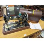A MAHOGANY CASED SINGER SEWING MACHINE