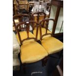 A SET OF FOUR ANTIQUE MAHOGANY DINING CHAIRS WITH CARVED DETAIL