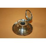 AN ANTIQUE SILVER CAPSTAN INKWELL