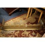 AN ANTIQUE BRASS CURVED FIRE FENDER W-110 CM