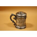 AN UNUSUAL ANTIQUE CONTINENTAL WHITE METAL MONEY BOX TANKARD DATED 1852